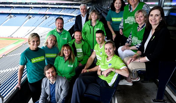 Samaritans volunteers with Limerick hurler Dan Morrissey and Dublin Ladies footballer Nicole Owens marking 10 years of the Samaritans GAA partnership