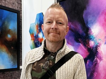 A photo of Chris in an art gallery
