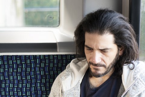 man-phone-bus-worried