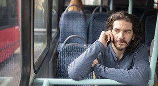 man-phone-bus