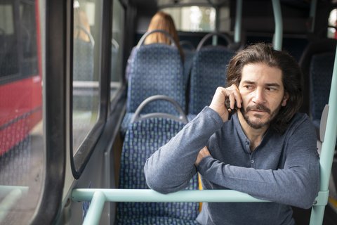man-phone-bus