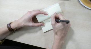 Woman-writing-office