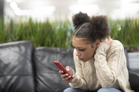 hunched-teen-phone