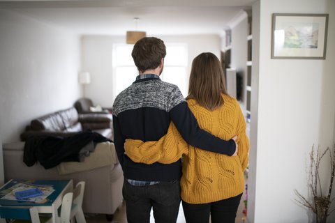 couple-hug-home