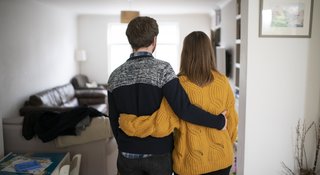 couple-hug-home