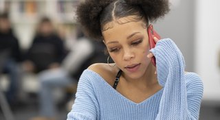 teen-listens-phone