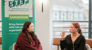 Two-people-talking-STEP-course-with-banner