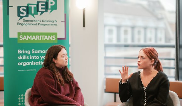 Two-people-talking-STEP-course-with-banner