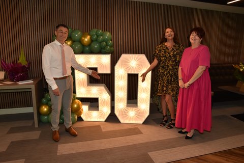 Dale 2, Lisa 5 & Judith 10 at 50th sign.