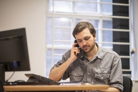 man-volunteer-phone