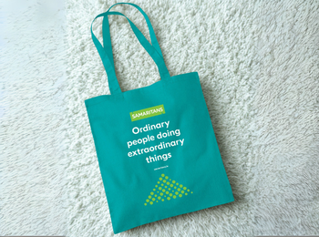 Green Samaritans tote bag with the slogan, 'Ordinary people doing extraordinary things'