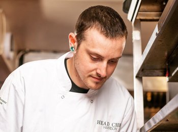 Harrison working as a chef