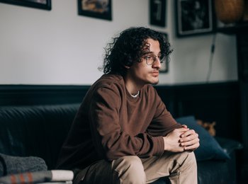 Man sitting home alone