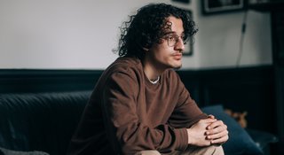 Man sitting home alone