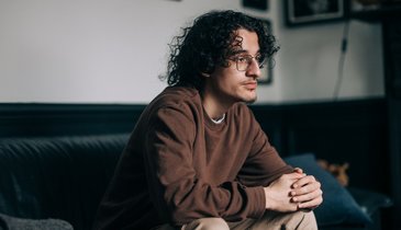 Man sitting home alone
