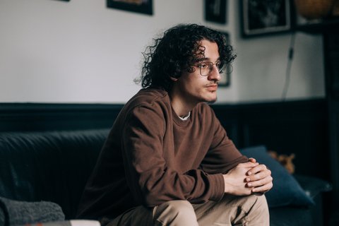 Man sitting home alone