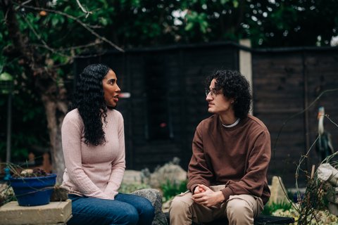 Home_372_AR - Two people in a garden talking