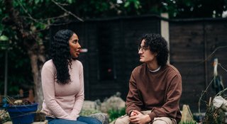 Home_372_AR - Two people in a garden talking