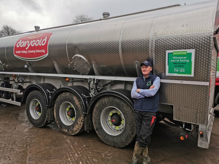 Dairy Farmer Peter Hynes with Samaritans signage on a Dairygold milk tanker at his farm in Co Cork