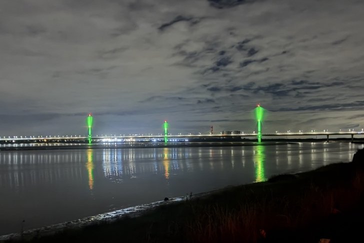 Mersey Gateway lit up - bankside view