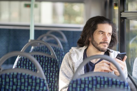 Man-phone-bus-highres