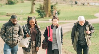 A group of people walking and smiling - Outside_123_AR