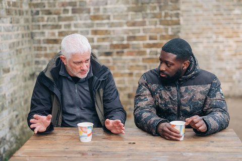 Two men on a bench outside - Outside 174_AR