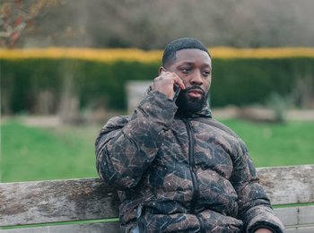Man on the phone on a bus