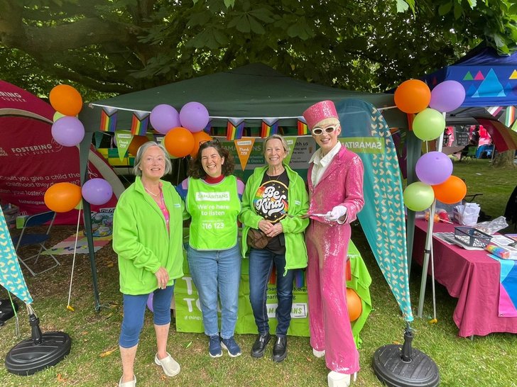 Chichester Pride volunteers with festival-goer