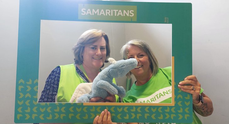 SamsFest volunteers with toy dragon