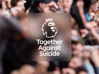 The "Together Against Suicide" logo on a photo of fans in a stadium