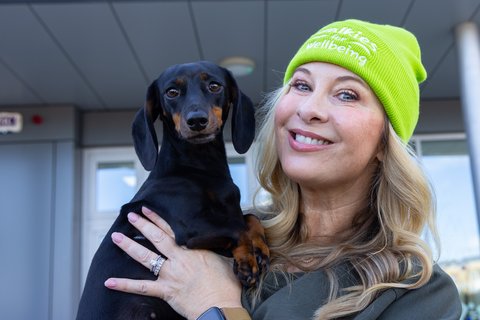 Laura Woods and her dog Chloe putting their best paw forward for Samaritans' Walkies for Wellbeing, supported by Village Vets