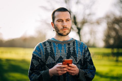 man-phone-outdoors-high-res.jpg