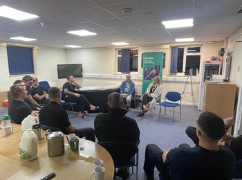 Volunteers facilitate a talk at Crawley Fire Station.