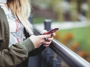 woman with phone in hand