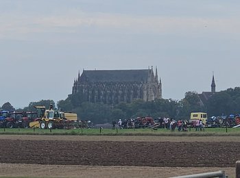 a field with a big house