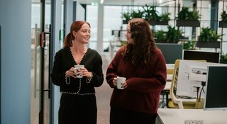 Two people during break at a STEP workplace training session