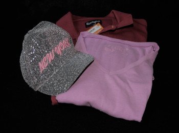Photo of two T Shirts and a New York Cap