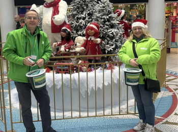 volunteers with donation buckets
