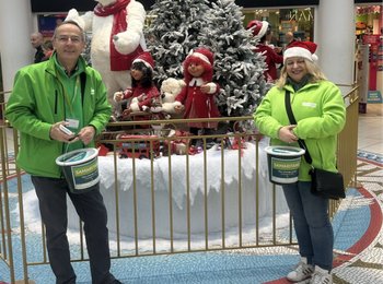 volunteers with donation buckets